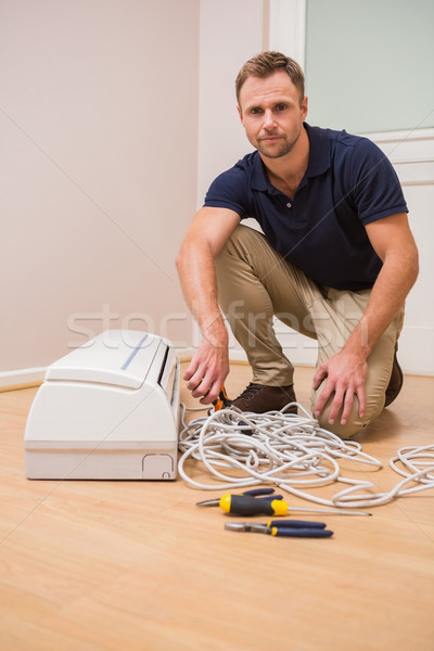 Focused handyman fixing air conditioning Stock photo © wavebreak_media