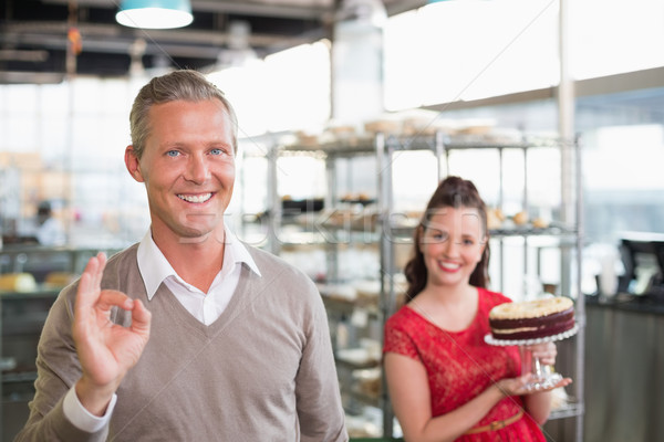 Stock photo: Cafe owners smiling at the camera