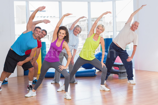 Fit people doing stretching exercise in gym Stock photo © wavebreak_media