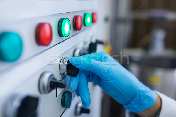 Hand with gloves turning buttons of the machine Stock photo © wavebreak_media