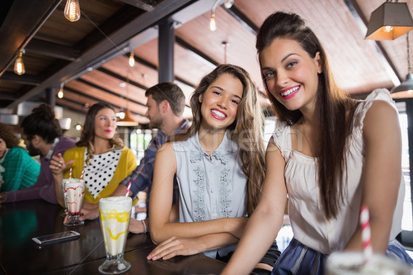 Female friends sitting at restaurant Stock photo © wavebreak_media