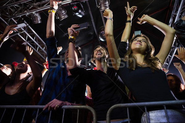 Stock photo: Crowd watching and taking photograph of performer
