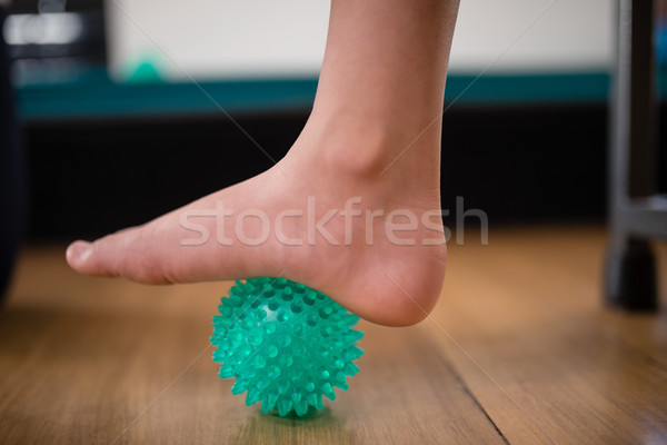 Low section of boy stepping on stress ball Stock photo © wavebreak_media