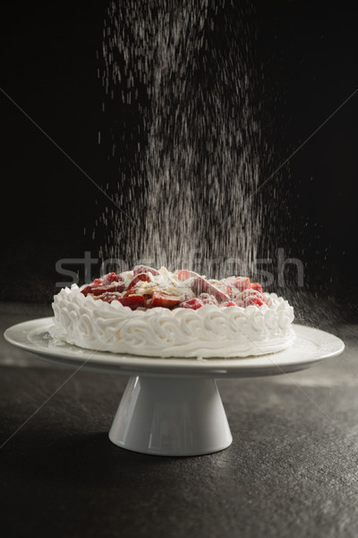 Powdered sugar falling over cake on stand Stock photo © wavebreak_media