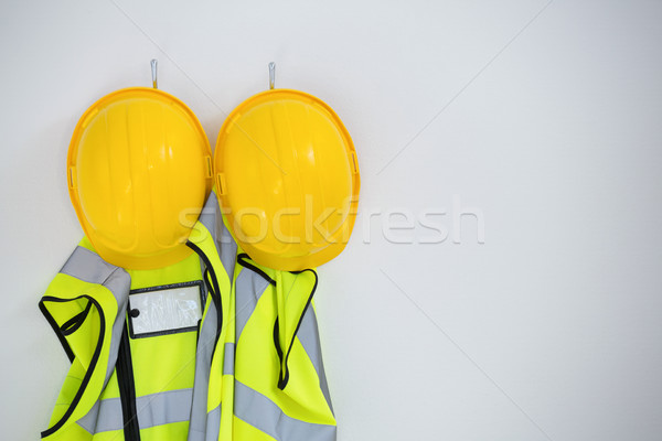 Close-up of protective workwear hanging on hook Stock photo © wavebreak_media