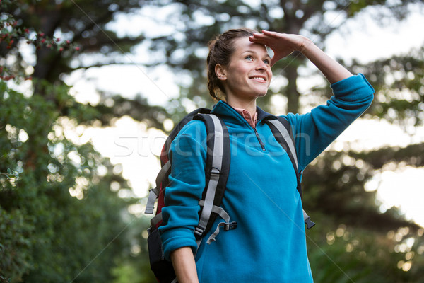 Female hiker shielding her eyes Stock photo © wavebreak_media