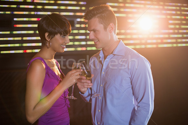 Couple toasting glass of champagne in bar Stock photo © wavebreak_media