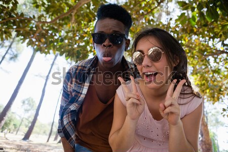 Schoolgirl whispering in her friends ear Stock photo © wavebreak_media