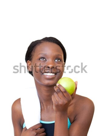 Stock photo: Young student holding books smiling at the camera 