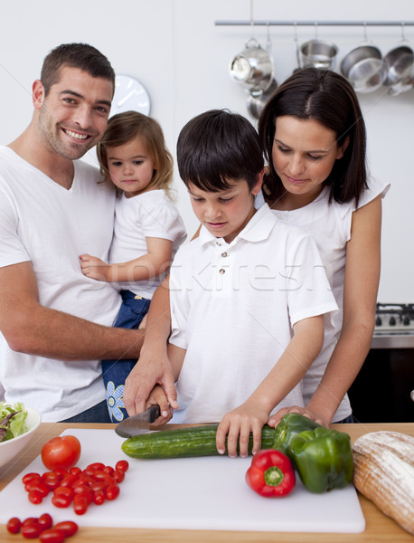 Cute son preparing food with his family Stock photo © wavebreak_media