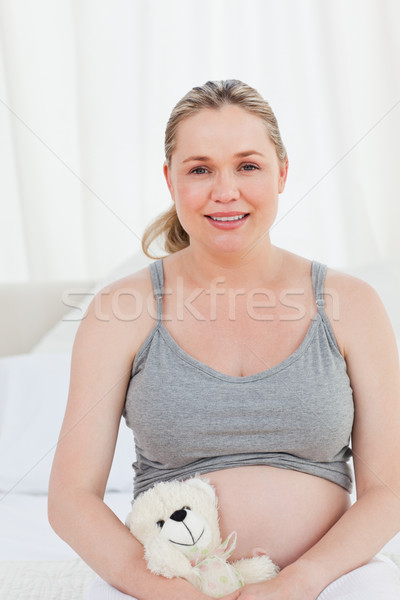 Pregnant woman with a cuddly toy at home Stock photo © wavebreak_media