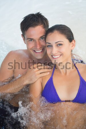 Casal sessão piscina de volta água Foto stock © wavebreak_media