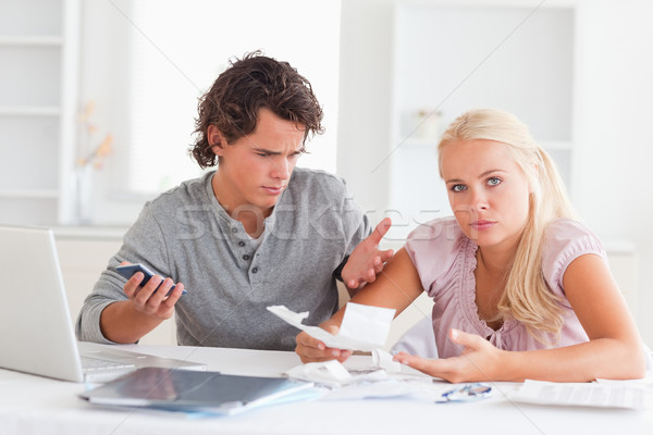 Clueless couple accounting in their living room Stock photo © wavebreak_media