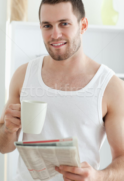 Portrait bel homme potable café lecture nouvelles [[stock_photo]] © wavebreak_media