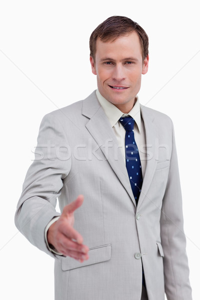 Zâmbitor om de afaceri oferind mână alb afaceri Imagine de stoc © wavebreak_media