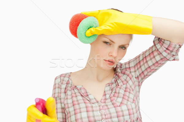 Woman wiping her frown while wearing cleaning gloves Stock photo © wavebreak_media