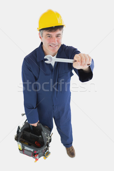 Mature mechanic with spanner carrying tool bag Stock photo © wavebreak_media
