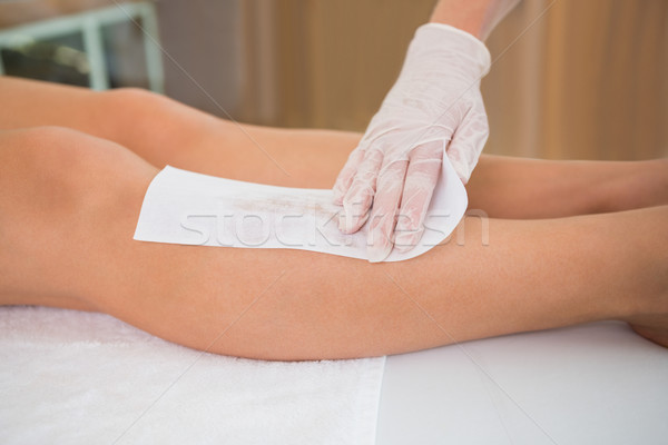 Woman getting her legs waxed by beauty therapist Stock photo © wavebreak_media