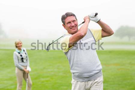 Fit couple standing drinking from water bottles Stock photo © wavebreak_media