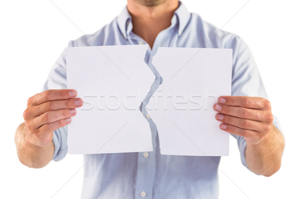Man holding torn white paper Stock photo © wavebreak_media