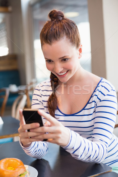 Young woman taking a photo of her lunch  Stock photo © wavebreak_media