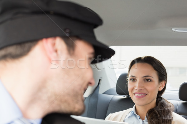 Young businesswoman being chauffeured while working Stock photo © wavebreak_media