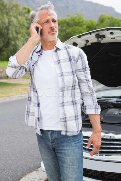 Stock photo: Stressed man calling 