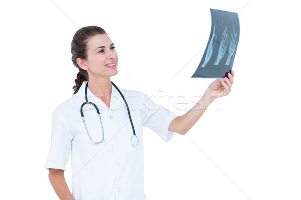 Concentrato medico guardando bianco muro donna Foto d'archivio © wavebreak_media