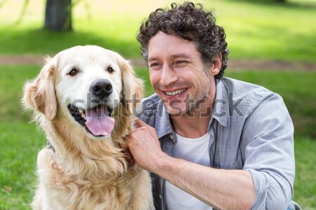 Porträt lächelnd Paar Sitzung zusammen Hund Stock foto © wavebreak_media