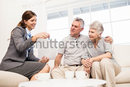 Couple doing their accounts sat in a couch Stock photo © wavebreak_media