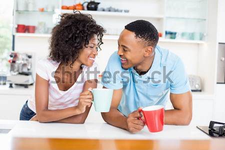 Casual business team looking at laptop together Stock photo © wavebreak_media