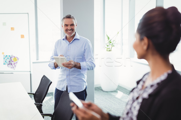 Happy executives interacting with each other Stock photo © wavebreak_media