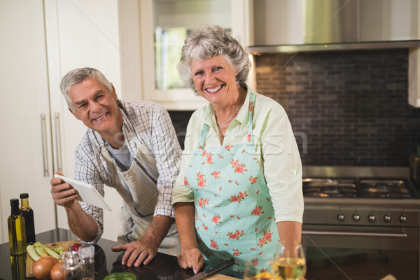 Portrait smiling senior couple standing by kitchen counter Stock photo © wavebreak_media