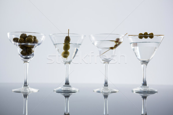 Koktél martini olajbogyók asztal közelkép fehér Stock fotó © wavebreak_media