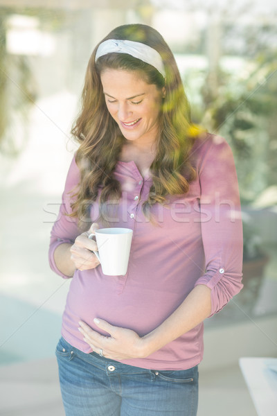 Stockfoto: Gelukkig · vrouw · koffiemok · zwangere · vrouw · permanente · venster