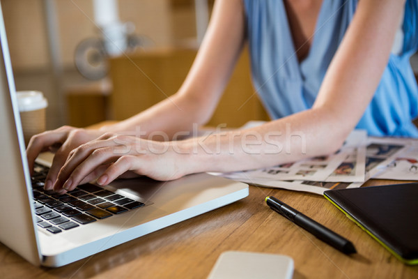 Woman using laptop in office Stock photo © wavebreak_media