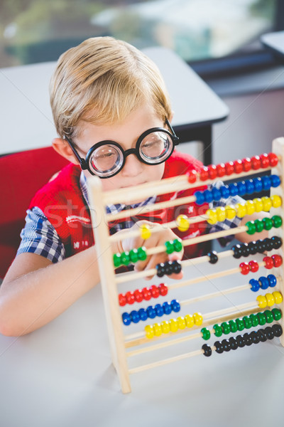 Close-up of schoolkid counting abacus in classroom Stock photo © wavebreak_media