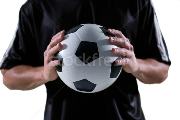 Mid-section of football player holding football with both hands Stock photo © wavebreak_media