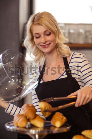 Charming young woman using a dishwasher  Stock photo © wavebreak_media