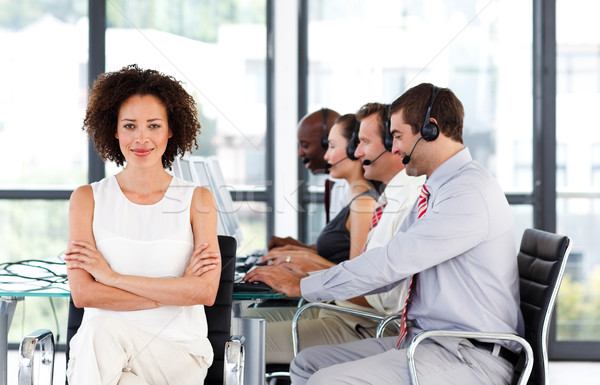 Stock photo: Young confident businesswoman working in a call center