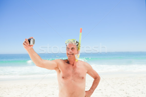 Hombre toma foto playa nina sonrisa Foto stock © wavebreak_media