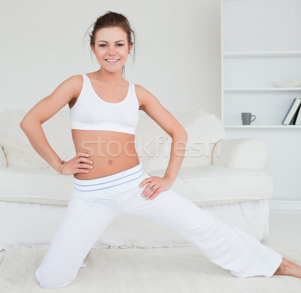 Fit young woman practicing yoga in her living room Stock photo © wavebreak_media