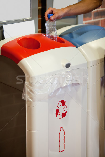 Portrait of a manly hand recycling a plastic bottle Stock photo © wavebreak_media