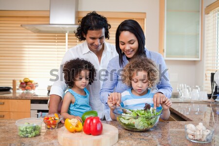 Family slicing ingredients together Stock photo © wavebreak_media