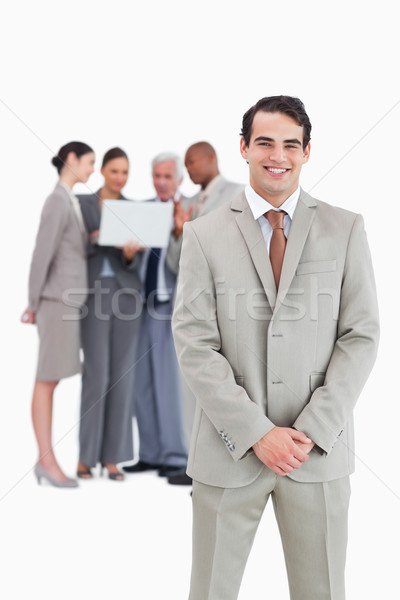 Zâmbitor om de afaceri echipă in spatele alb afaceri Imagine de stoc © wavebreak_media