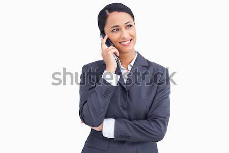 Close up of saleswoman on her mobile phone against a white background Stock photo © wavebreak_media