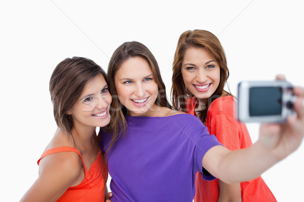 Mooie tieners tonen glimlacht digitale camera focus Stockfoto © wavebreak_media