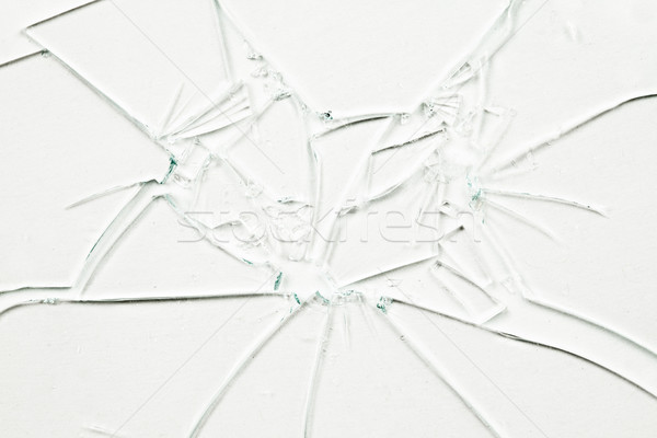 Many broken glasses against a white background Stock photo © wavebreak_media
