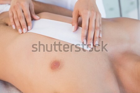Doctor using two finger while massaging his patient in a room Stock photo © wavebreak_media