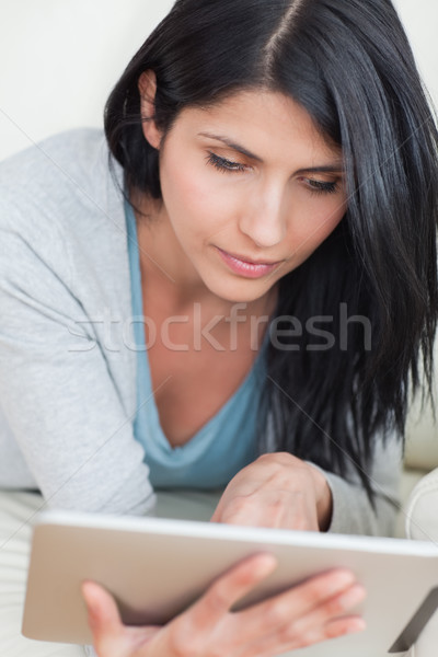 Close up of a woman playing with a tactile tablet Stock photo © wavebreak_media